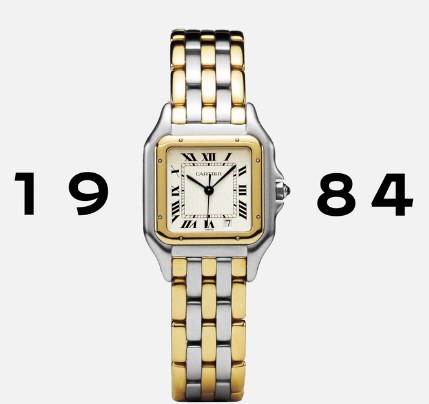 Cartier Panthère aus 1984 in Bicolor vor weißem Hintergrund mit dem Schriftzug 1984 in schwarzen Lettern.