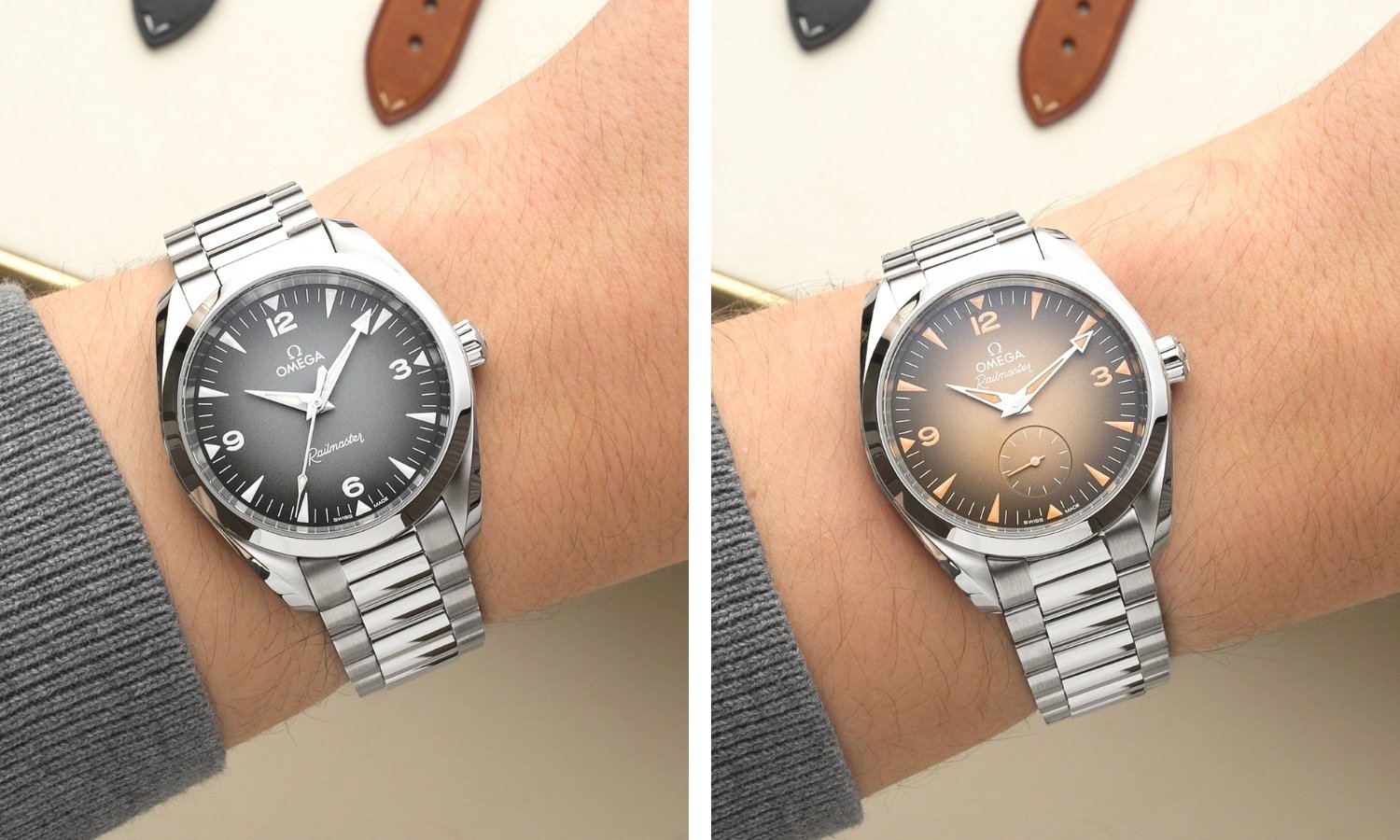 Die OMEGA Seamaster Railmaster Referenz: 235.10.38.20.06.001 mit grauem Zifferblatt am Edelstahlarmband links und die OMEGA Seamaster Railmaster Referenz: 235.10.38.20.13.001 mit beigem Zifferblatt am Edelstahlarmband rechts jeweils an einem Handgelenk mit grauem Ärmel getragen