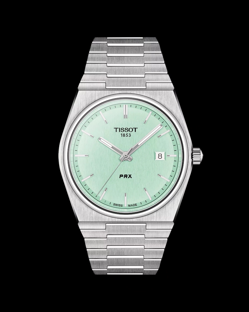 Vorderseite der minzgrünen TISSOT PRX auf schwarzem Hintergrund
