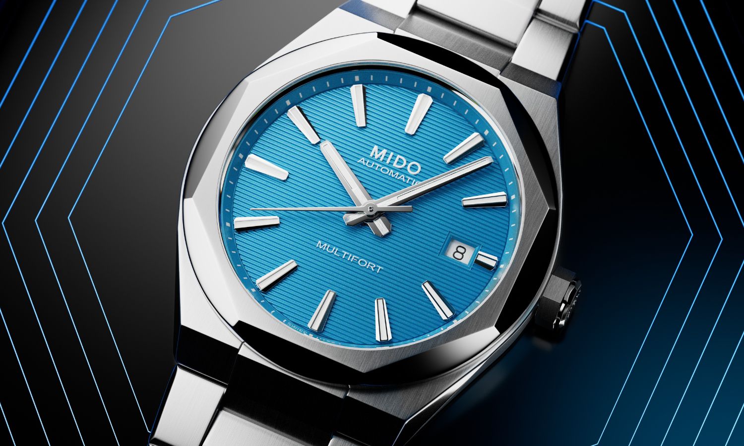 Mido Multifort 8 One Crown Referenz M055.507.11.041.00 mit blauem Zifferblatt am Edelstahlarmband liegend auf schwarz-blauem Untergrund