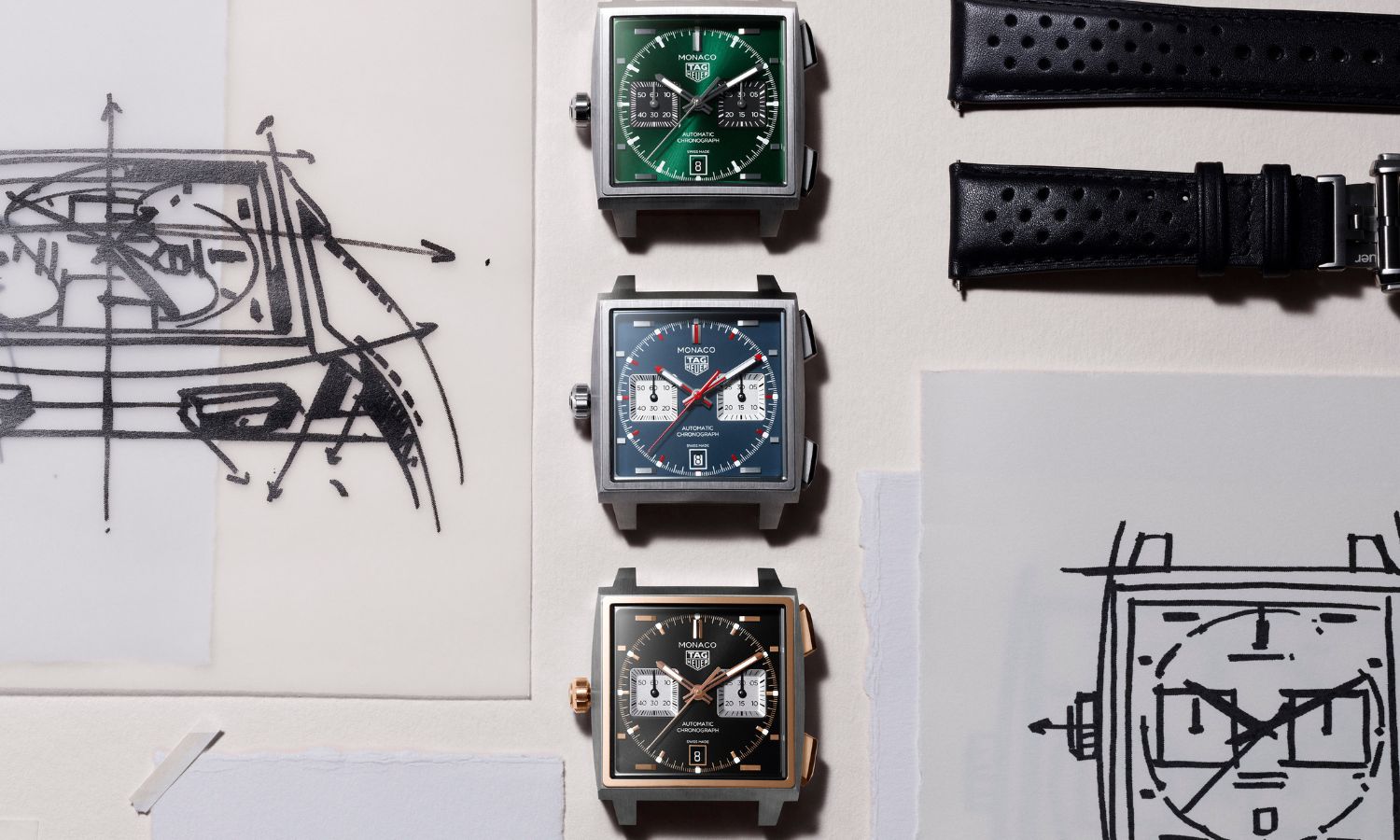 Blick von oben auf die drei neuen Modelle der TAG Heuer Monaco, die 2026 auf den Watches & Wonders präsentiert wurden.